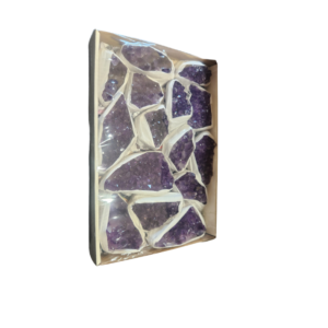 Box of A Grade purple amethyst crystal pieces, individually wrapped and arranged in a tray