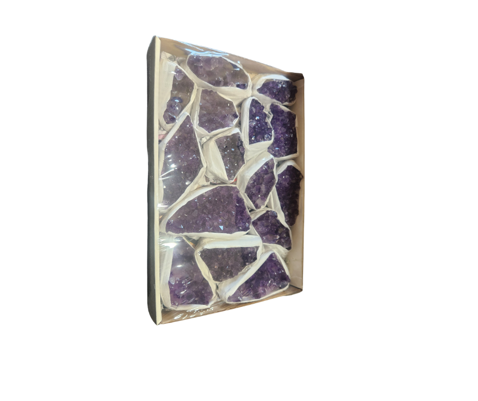 Box of A Grade purple amethyst crystal pieces, individually wrapped and arranged in a tray