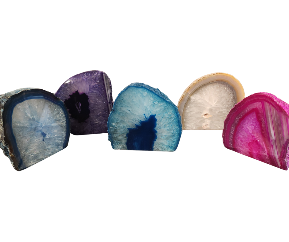 Five agate candle holders in blue, purple, teal, natural, and pink colors with banded edges and crystal interiors