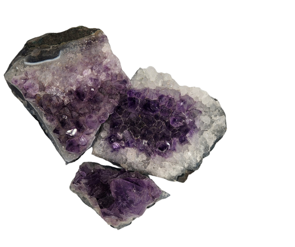 Three free form amethyst clusters with purple crystal points and pale quartz borders