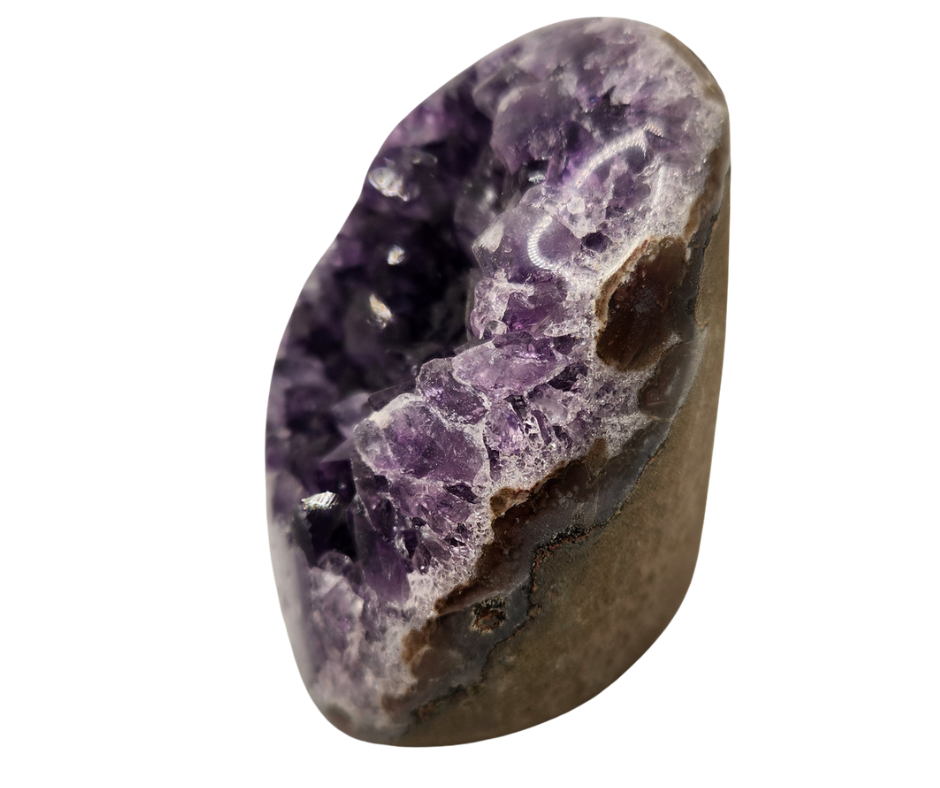 Amethyst druze specimen with purple crystal cavity, polished edges and a cut base