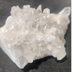 Natural white and clear quartz cluster with multiple crystal points